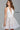 Jovani ivory low v-neck fit and flare short dress 55738